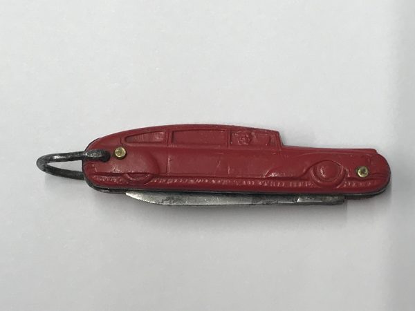 Vintage Richards of Sheffield figural red car pocket knife, folded closed with tin handle, steel blade tucked in, key-ring loop visible; 1.5-inch blade (folded view)