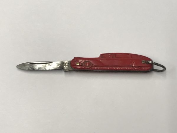 Vintage Richards of Sheffield red car figural pocket knife, blade open—1.5-inch steel blade extended with red pressed-metal handle and key-ring loop