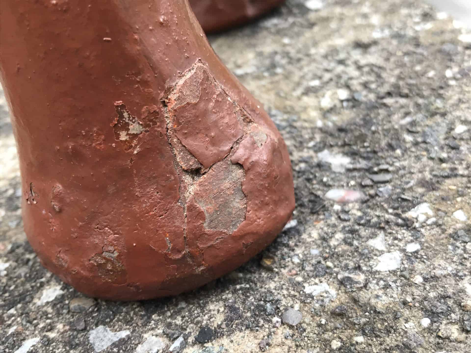 Close-up of damage and wear on the foot of a Javanese terracotta elephant moneybox