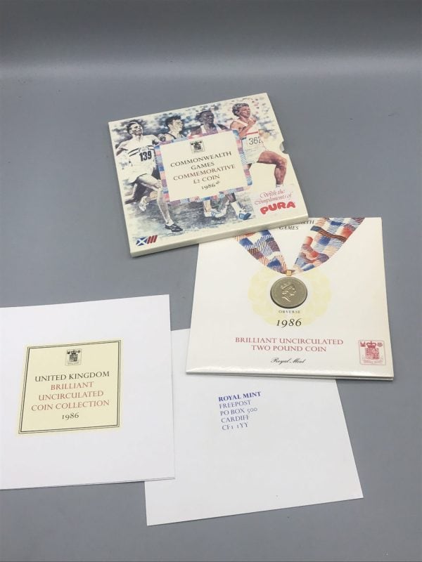 Complete set of the 1986 Royal Mint £2 Commonwealth Games coin, including the coin in folder, commemorative sleeve, and original Royal Mint paperwork