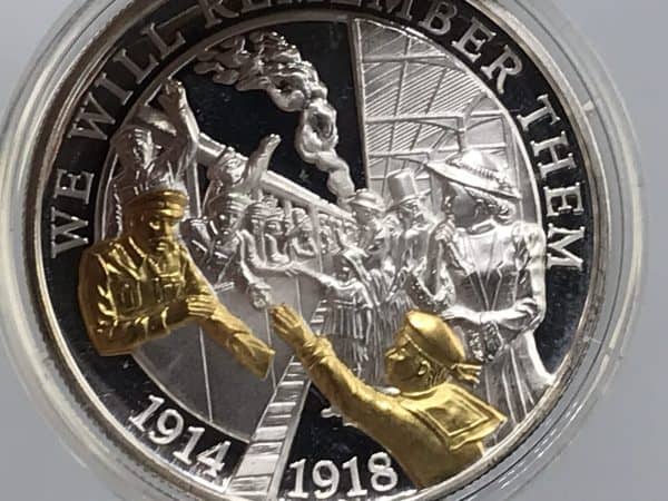 Front of 2018 In Flanders Fields Museum “Seeing the Soldiers Off” proof coin showing gold-accented soldiers design
