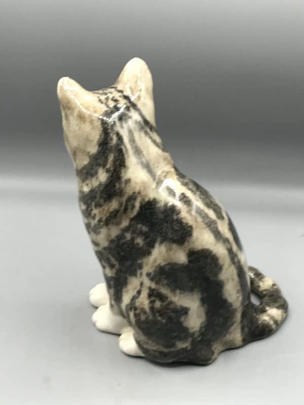 Rear view of a Winstanley pottery cat figurine showing detailed marbled glaze pattern