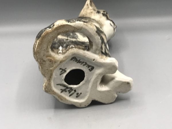 Base of a Winstanley pottery cat figurine showing maker’s mark and signature