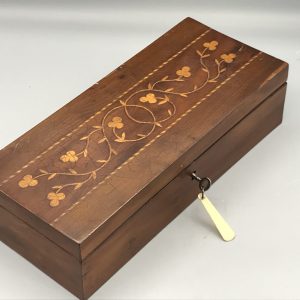 antique inlaid wooden box with floral marquetry and working key