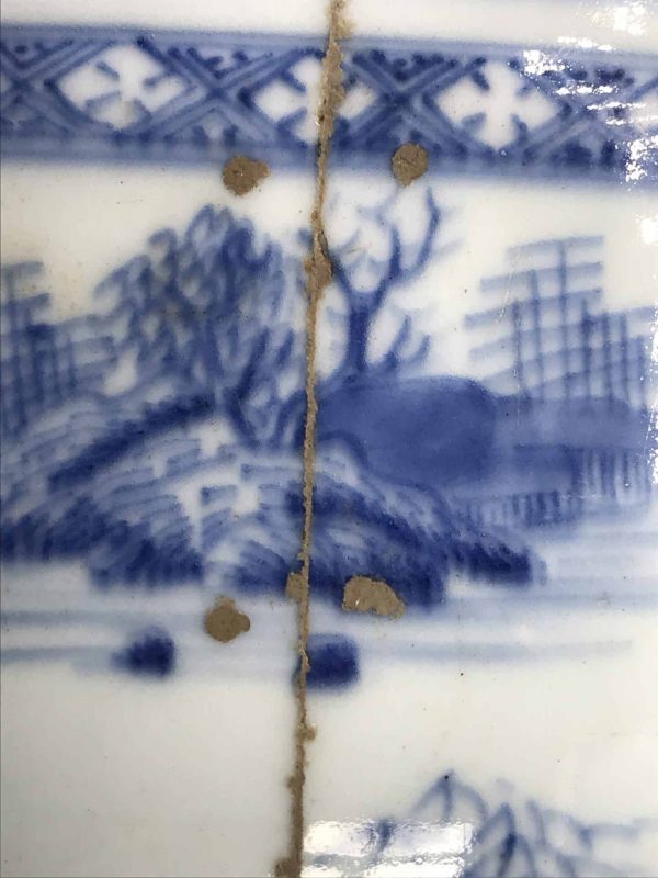 Close-up of 18th century Chinese export porcelain tureen, Qianlong era, showing historic break and Japanese Kintsugi gold repair along the surface