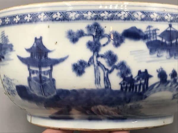 Close-up of 18th century Chinese export porcelain tureen, Qianlong era, showing detailed blue and white landscape pattern with pagoda and trees