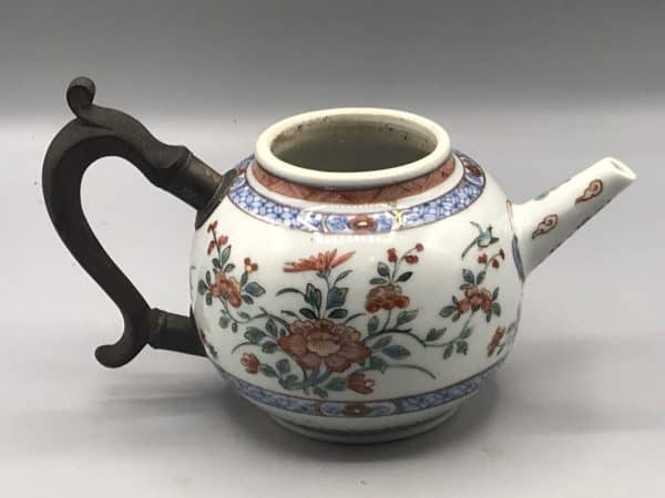 18th century Kangxi Chinese porcelain teapot, globular form with famille verte floral decoration and later European metal handle, opposite side view without lid