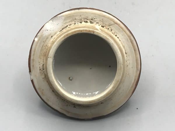 Underside of domed lid from 18th century Kangxi Chinese porcelain teapot showing unglazed rim and famille verte decoration