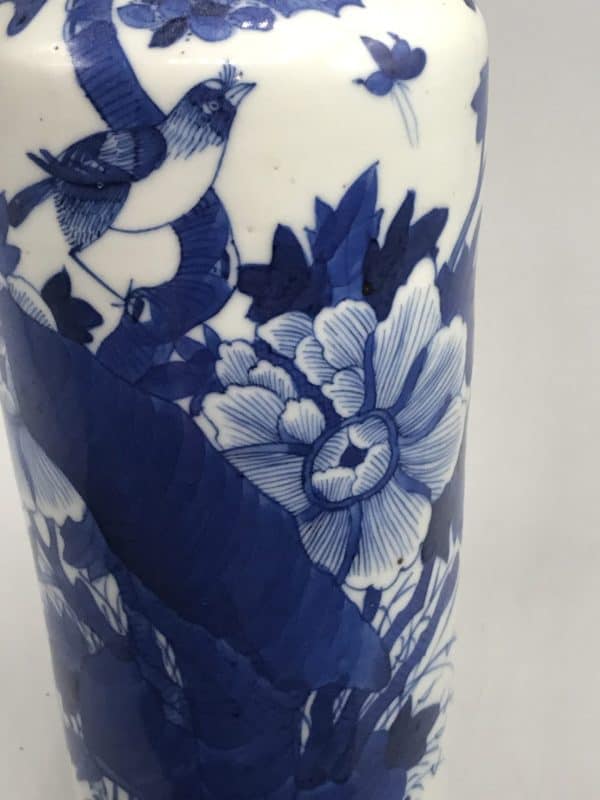 Close-up of 1920s Chinese export porcelain vase showing bird perched among blue floral motifs, Republic era