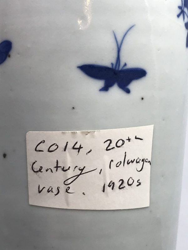 Back view of 1920s Chinese export porcelain vase with handwritten label and blue butterfly motif, Republic era