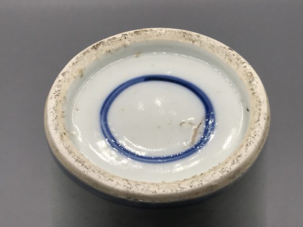 Base of 1920s Chinese export porcelain vase showing double blue ring mark and unglazed foot rim