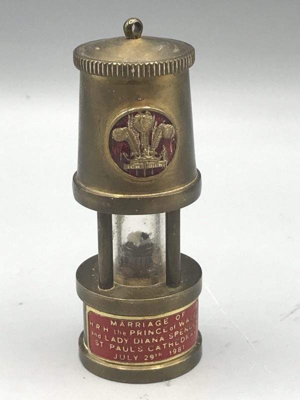 Front view of 1981 brass commemorative miner’s lamp featuring Prince of Wales feathers and wedding plaque