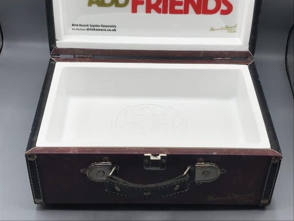 Interior base of vintage Bacardi suitcase ice box cooler with white molded liner and embossed bat logo