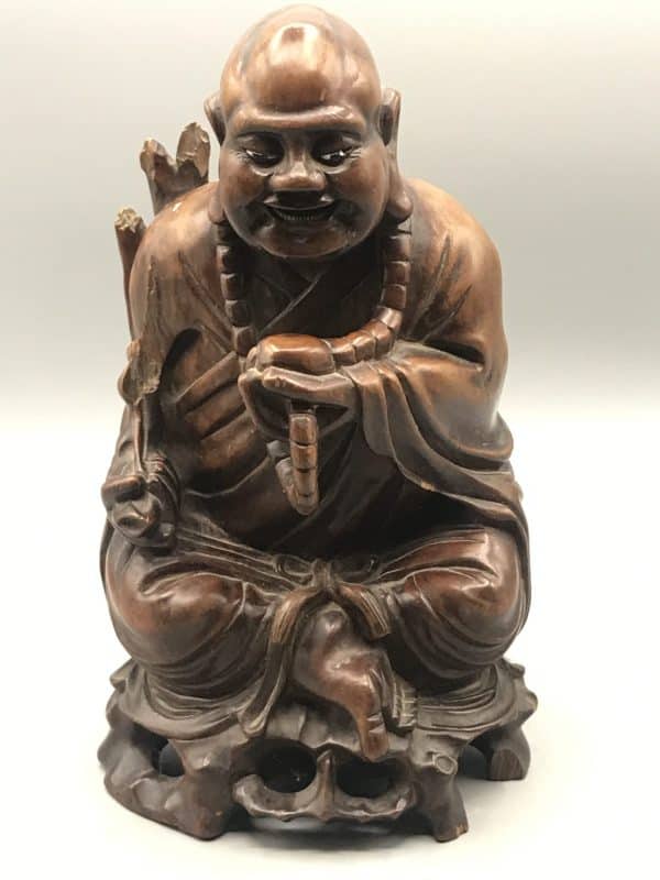 Antique Chinese carved hardwood Buddha statue, full front view, depicting Budai seated with prayer beads, measuring 10 inches tall