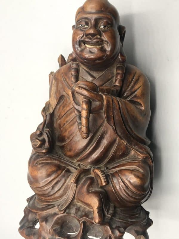 Antique Chinese carved hardwood Buddha statue, alternate front angle, showing Budai seated with prayer beads and flowing robes, 10 inches tall