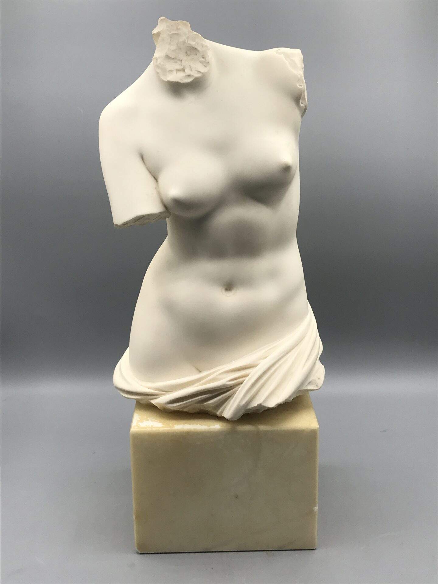 Alabaster Venus torso bust on marble base, front view of 14.5-inch sculpture signed A. Giannelli