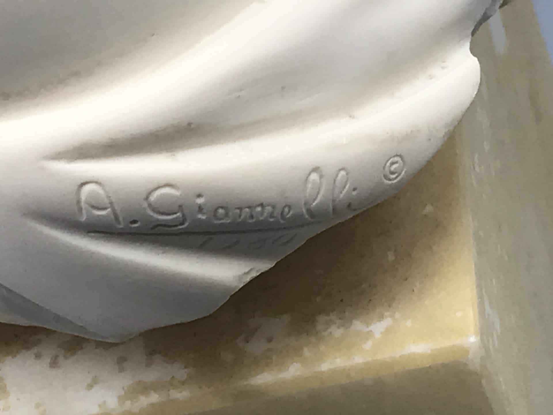 Close-up of A. Giannelli signature on alabaster Venus torso bust marble base