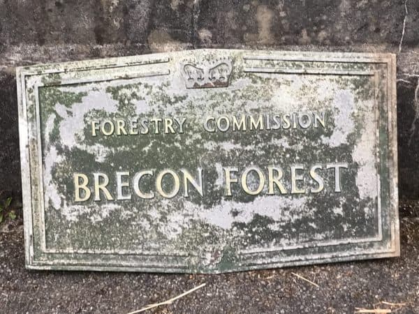 Cast aluminium Forestry Commission sign for Brecon Forest with crown and dragon motifs, mid 20th century, measuring 30 x 17 inches