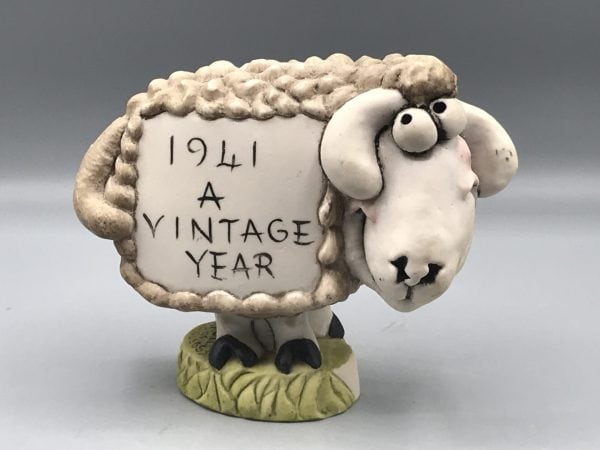 Grogg sheep figurine by John Hughes with “1941 A Vintage Year” inscription, full front view showing exaggerated wool texture and expressive face