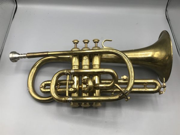 Side view of vintage brass cornet by Lark Shanghai China, mid-20th century, approximately 14 inches long