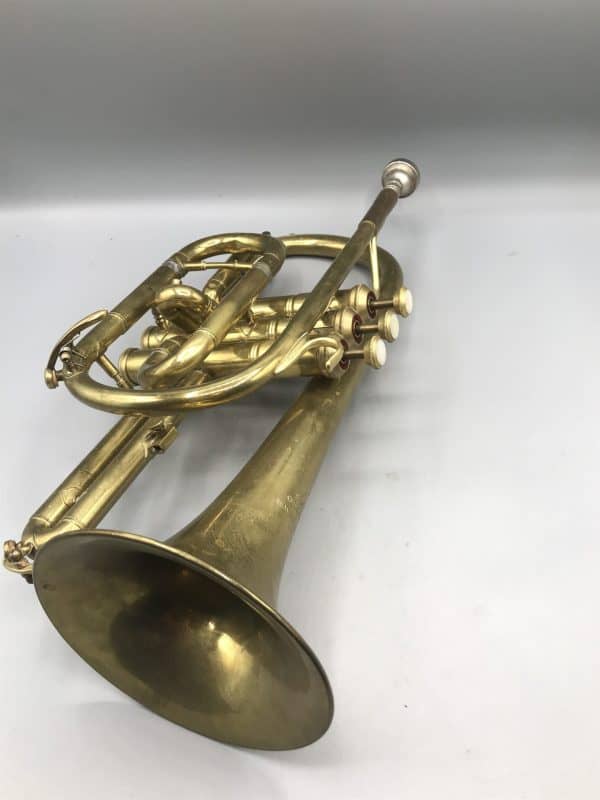 Front view of vintage brass cornet by Lark Shanghai China, mid-20th century, showing bell and valve section