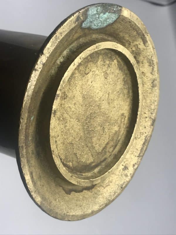 Underside of the base of an antique brass salinometer boiler test pot, late 19th to early 20th century maritime engineering piece showing original patina and natural wear