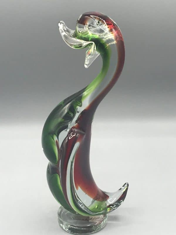 Mid-century Murano glass duck figurine in red and green cased clear glass, standing just under 9 inches tall, facing left