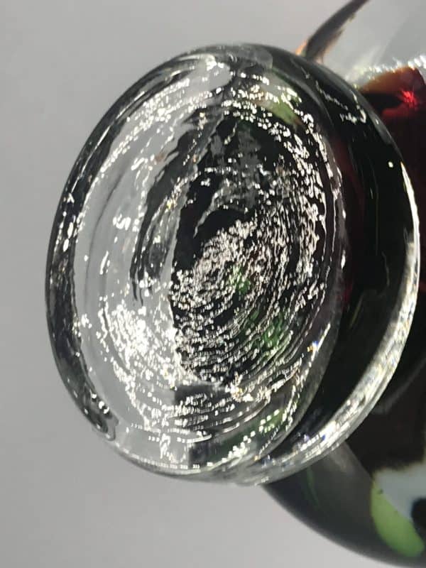 Underside of Murano glass duck figurine, polished clear glass base with swirl tooling marks, mid-century Italian art glass
