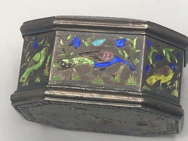 Antique silver enamel snuff box, side view, decorated with colorful bird and foliage motifs in enamel on silver