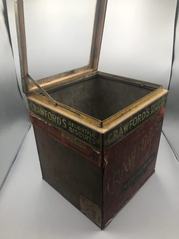 Antique Crawfords biscuit shop display tin with glass lid shown open, interior visible with metal brackets