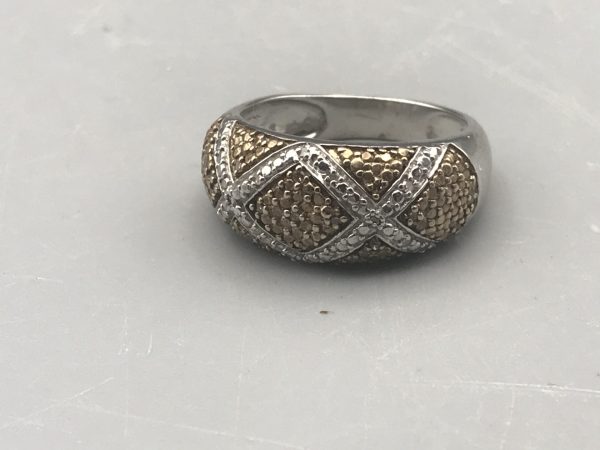 Sterling silver two-tone TGGC ring featuring gold textured panels with raised silver crisscross bands, photographed from the front to show the full pattern.
