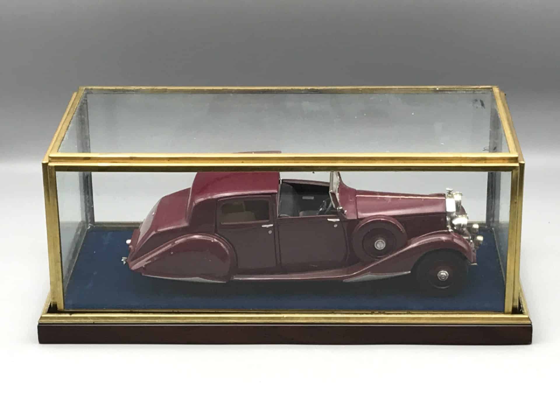 Danbury Mint 1938 Rolls-Royce Phantom III die-cast model displayed inside its brass and glass case on blue velvet base