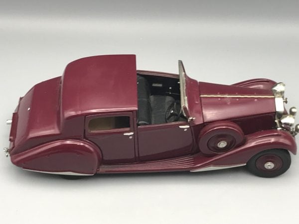Side view of Danbury Mint 1938 Rolls-Royce Phantom III Sedanca de Ville die-cast model in garnet finish