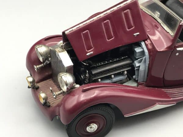 Close-up of Danbury Mint 1938 Rolls-Royce Phantom III die-cast model showing detailed engine with bonnet open