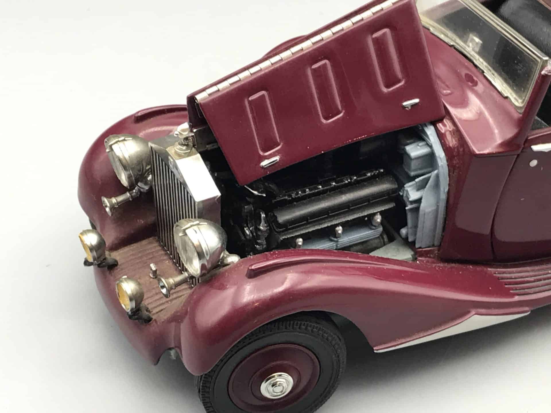 Close-up of Danbury Mint 1938 Rolls-Royce Phantom III die-cast model showing detailed engine with bonnet open