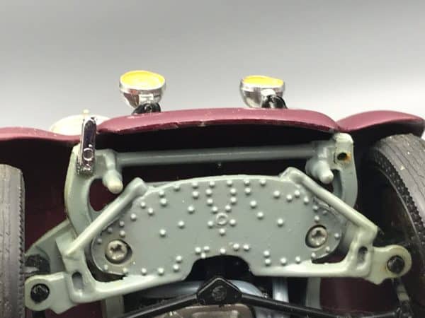 Close-up of front underside of Danbury Mint 1938 Rolls-Royce Phantom III die-cast model showing missing chrome bumper