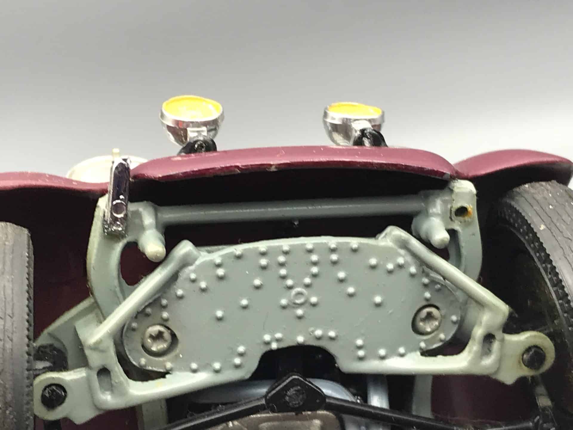Close-up of front underside of Danbury Mint 1938 Rolls-Royce Phantom III die-cast model showing missing chrome bumper