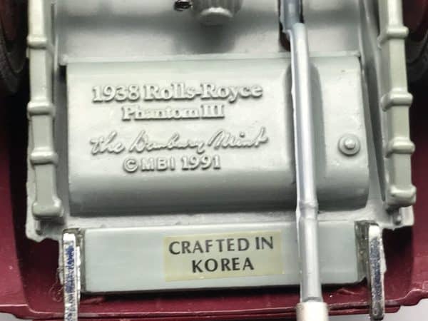 Underside markings on Danbury Mint 1938 Rolls-Royce Phantom III die-cast model showing maker’s stamp and “Crafted in Korea” label