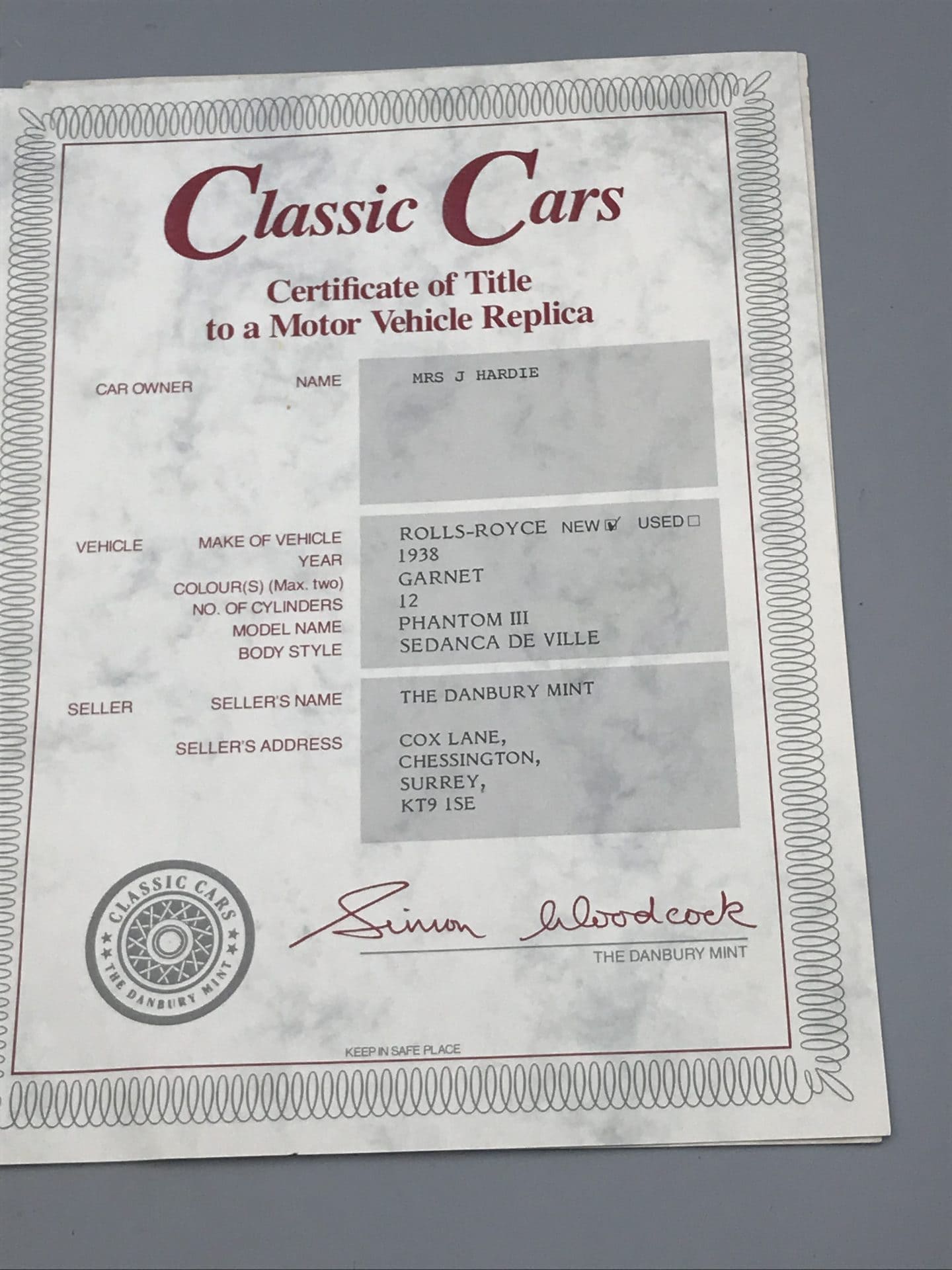 Certificate of Title for a Danbury Mint die-cast 1938 Rolls-Royce Phantom III Sedanca de Ville model car, issued to Mrs J. Hardie