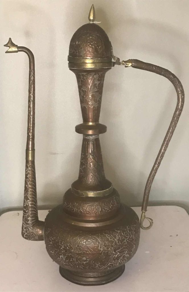 Monumental Ottoman copper and brass ceremonial ewer with swan-head spout, tall baluster neck, domed lid and curved handle, richly repoussé decorated with floral motifs, late 19th century, approximately 32 inches tall